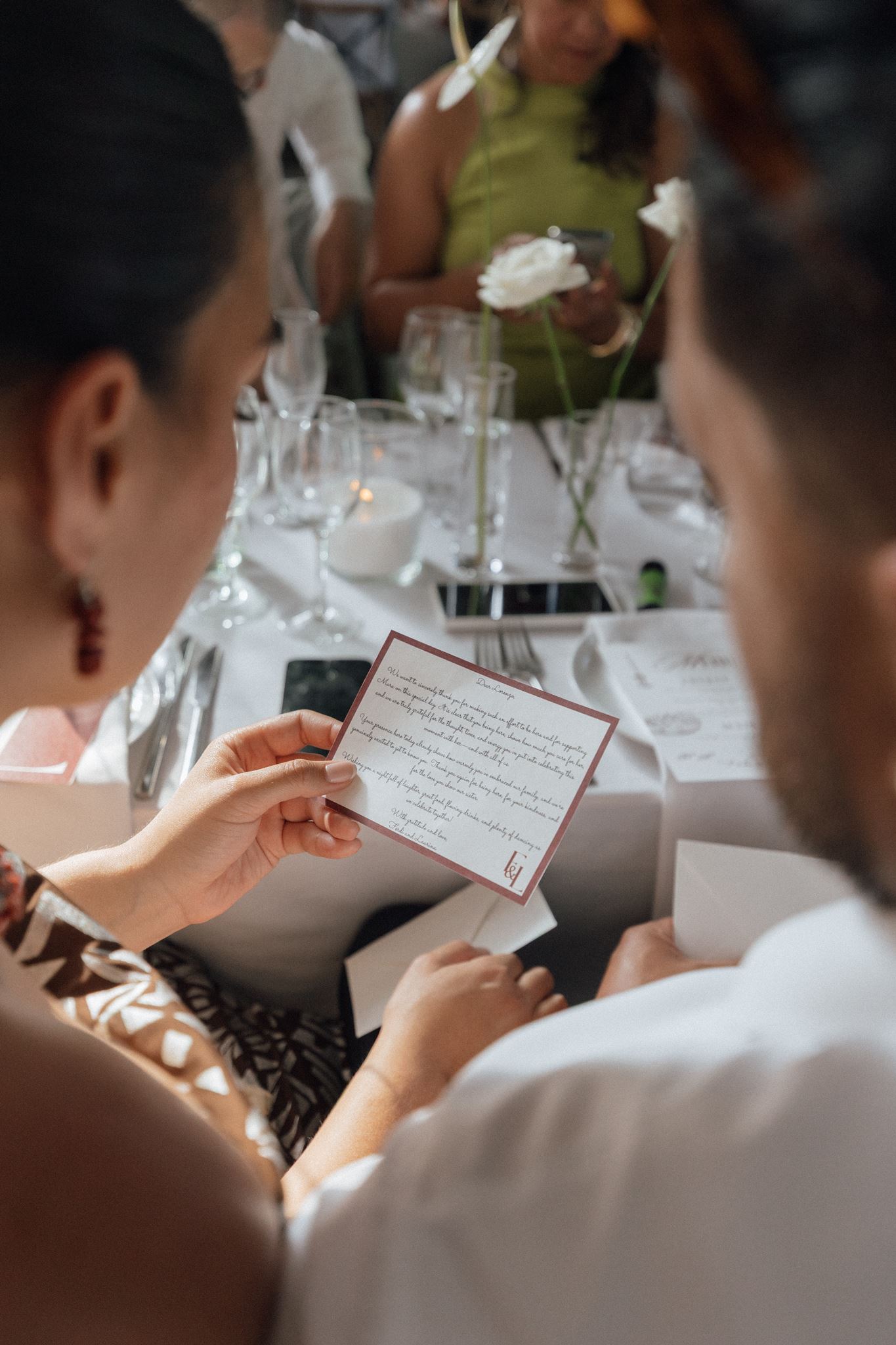 guests reading love notes at wedding