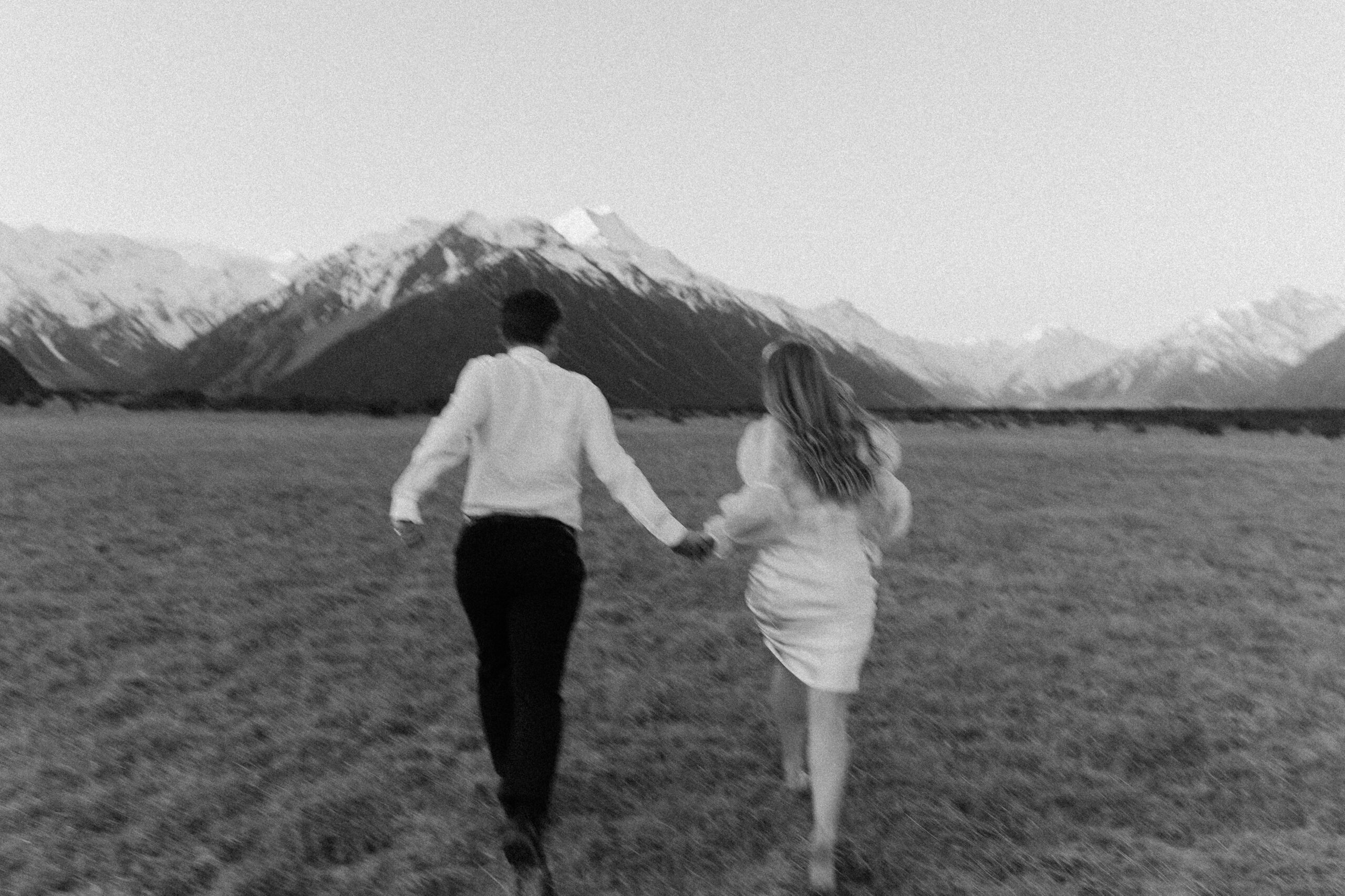 couple running during pre wedding shoot